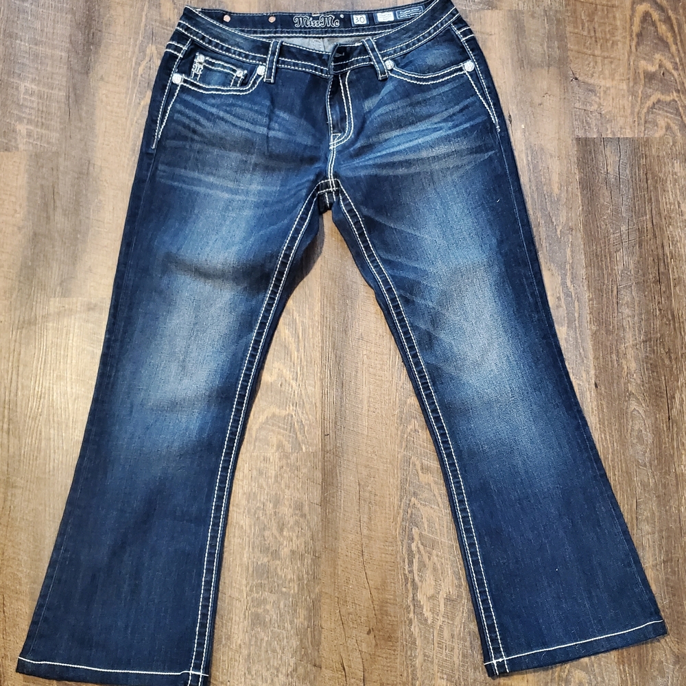 Always Shine" in these iconic Y2K Miss Me 
Mid-Rise Bootcut Jeans (Size 30)!